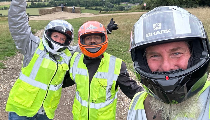 Paul and his riding companions successfully troubleshoot and replace a stubborn visor screw on a motorcycle helmet